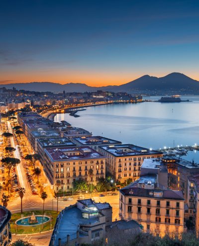 Naples, Italy aerial skyline on the bay with Mt. Vesusvius at dawn.